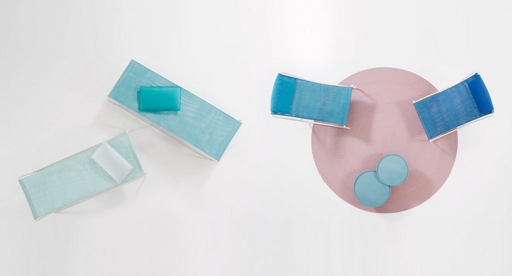 two loungers made of white steel and maris fabric in a blue tone on a white background