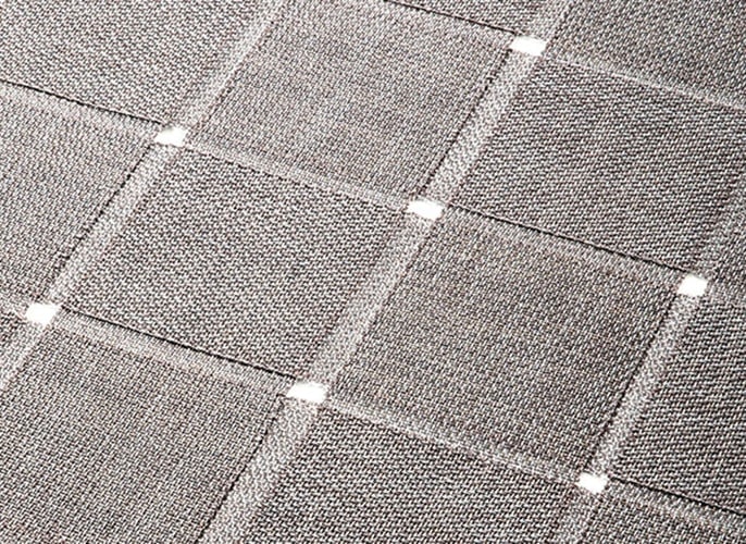 carpet made in two layers of parallel strips on a fabric base in white with gray tone in the shape of squares