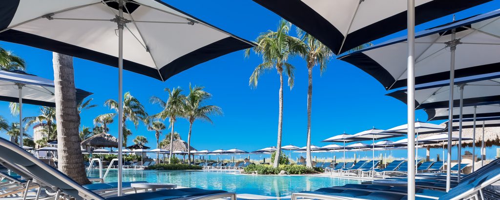line of square umbrellas made from metla and fabric in a tone of white with blue