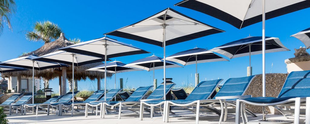 line of square umbrellas made from metla and fabric in a tone of white with black
