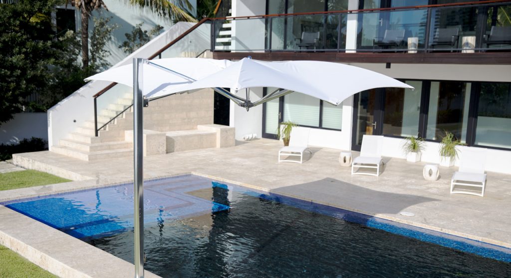 parasol with polished titanium frame on the side and fabric on the top in a white and gray tone