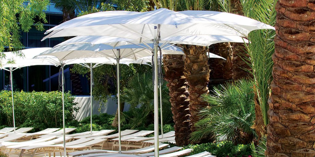 three geometric shaped umbrella made of metal and fabric in a white tone