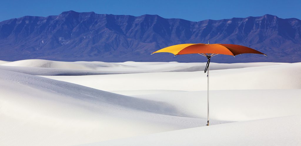 geometric shaped umbrella made of metal and fabric in a orange tone