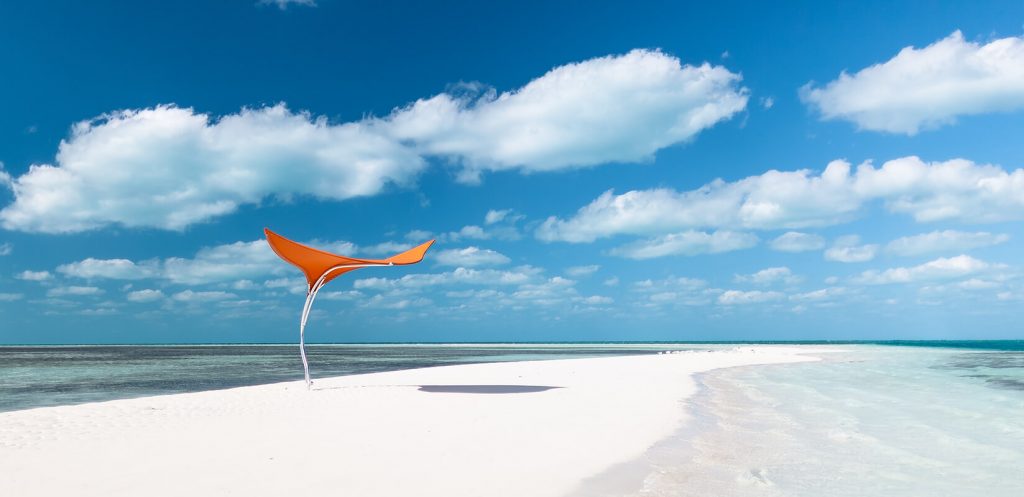 parasol made on the basis of a wing in a combination of marine elements and materials in a orange tone