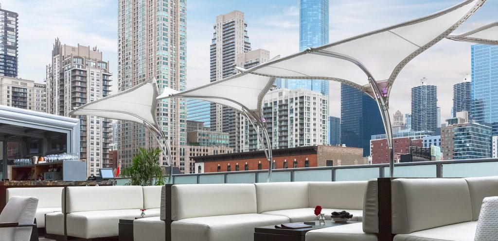 four umbrellas made in the shape of a wing based on various marine materials in a white tone