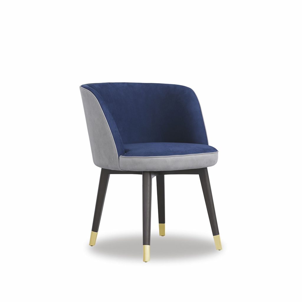 dining chair made of mixed upholstery on ash legs with brass tops in a black tone