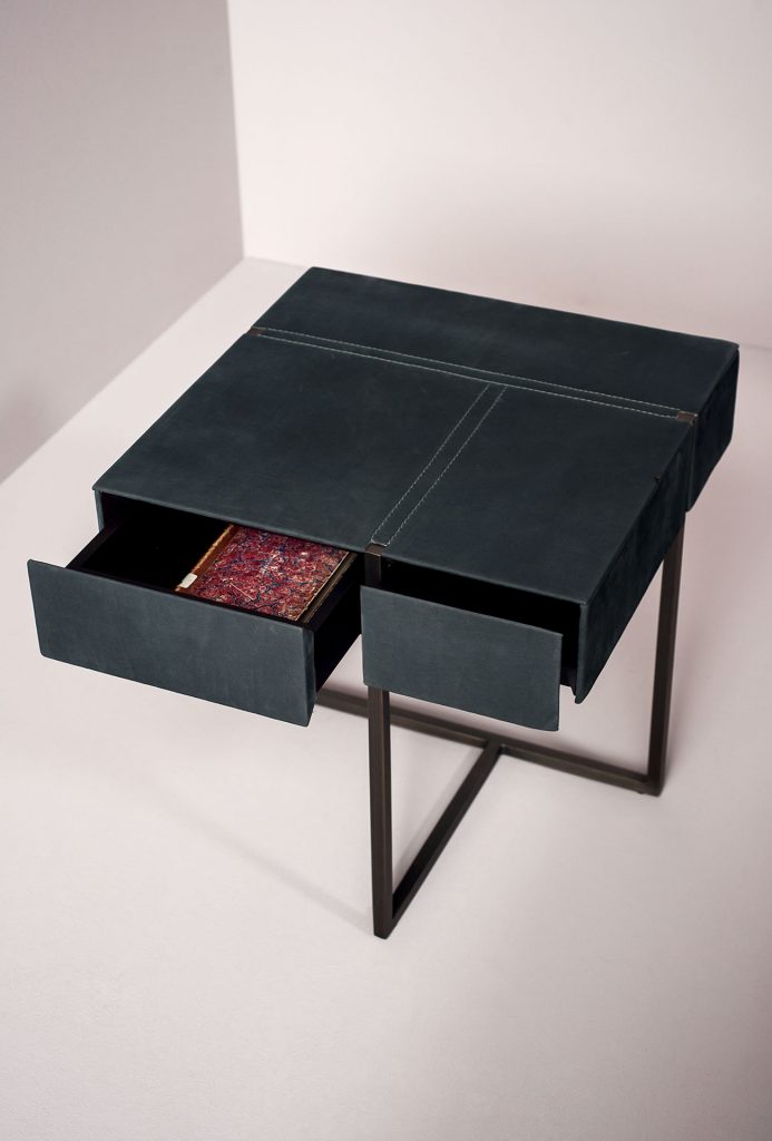 night table made of metal base and upholstered in blue leather with fired finishes