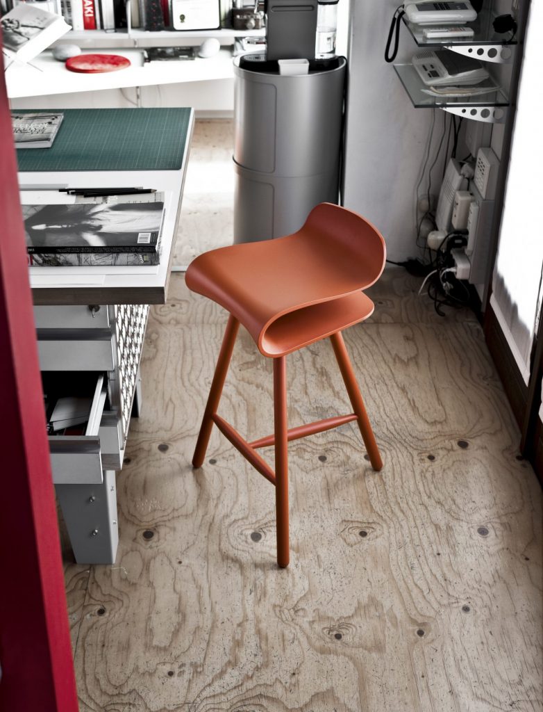 bent wooden chair made from wood in an orange tone