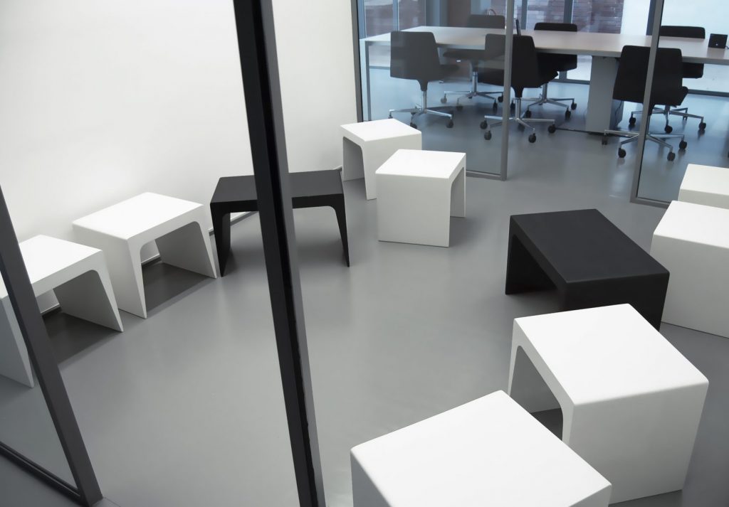 line of coffee tables made with a wooden base in black and white tones