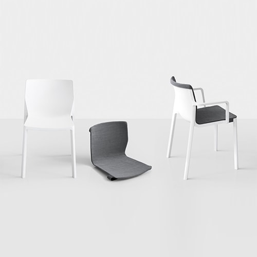 chairs made of molded polypropylene and removable cushions in a tone of white and gray