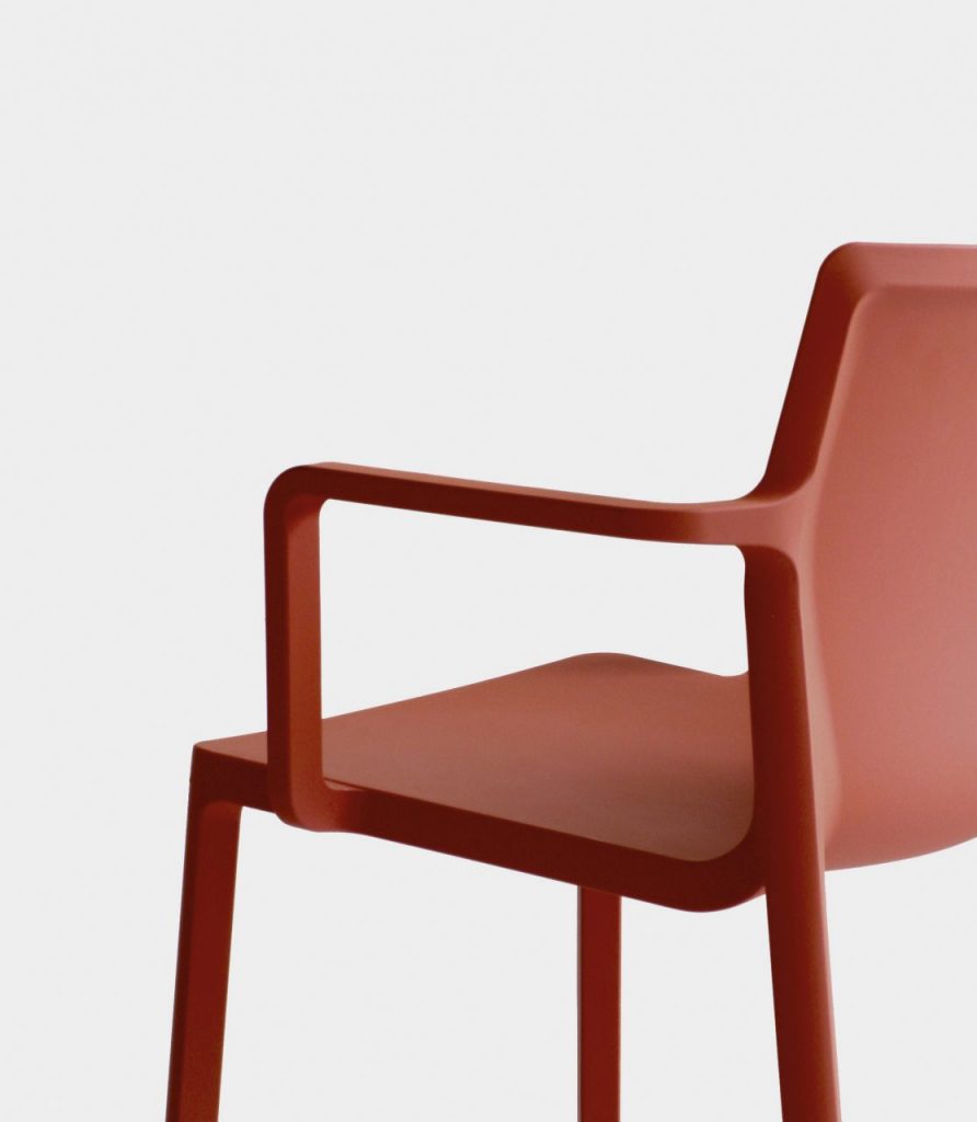 one tone red chair made of matte molded polypropylene base on a white background