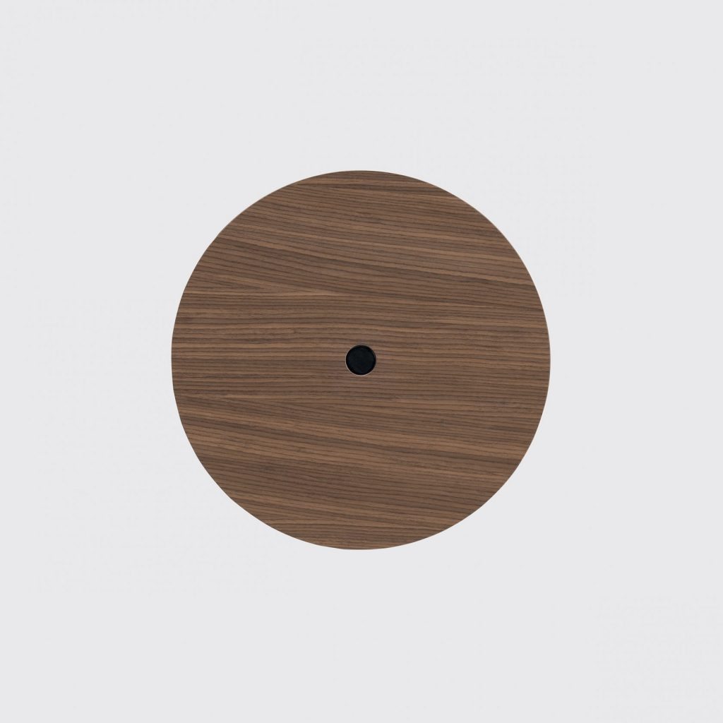 table made in the shape of a circle with a button in the center that regulates the height in brown tone