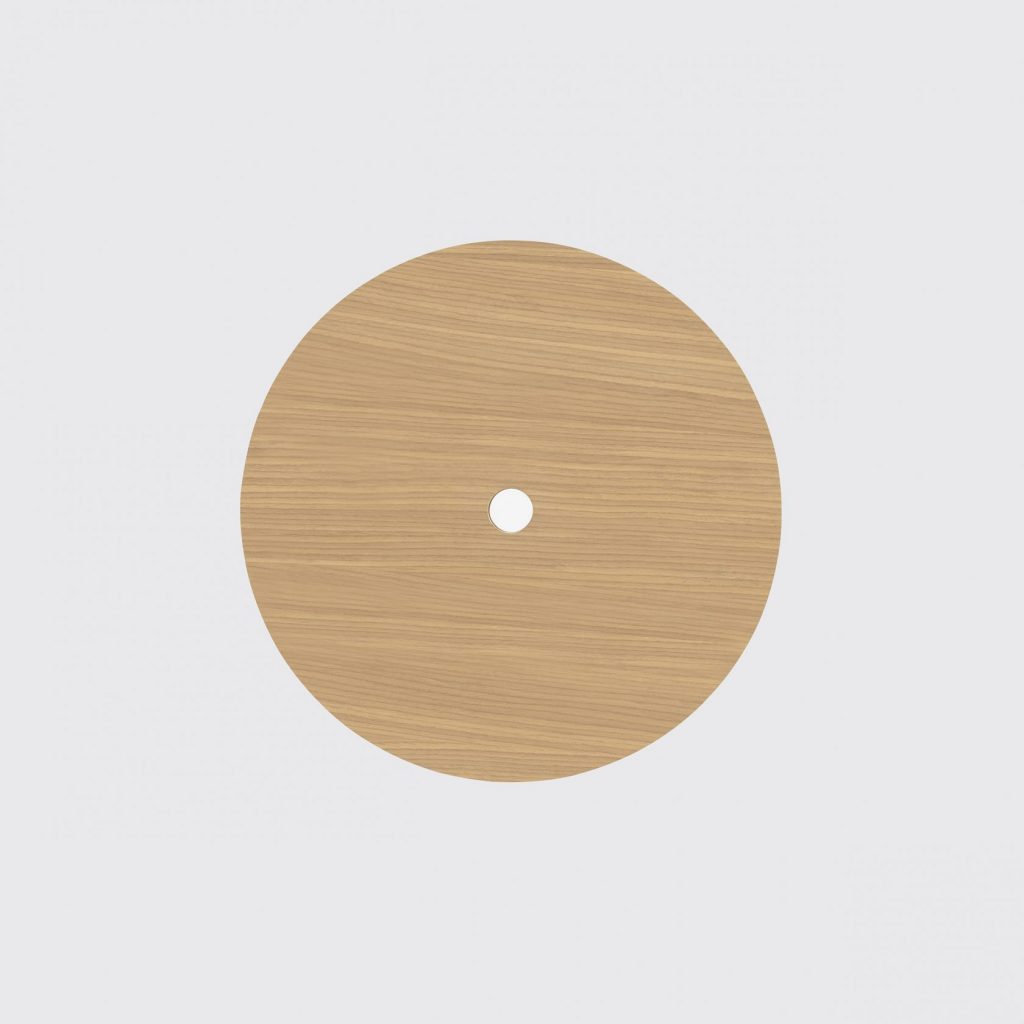 table made in the shape of a circle with a button in the center that regulates the height in beige tone