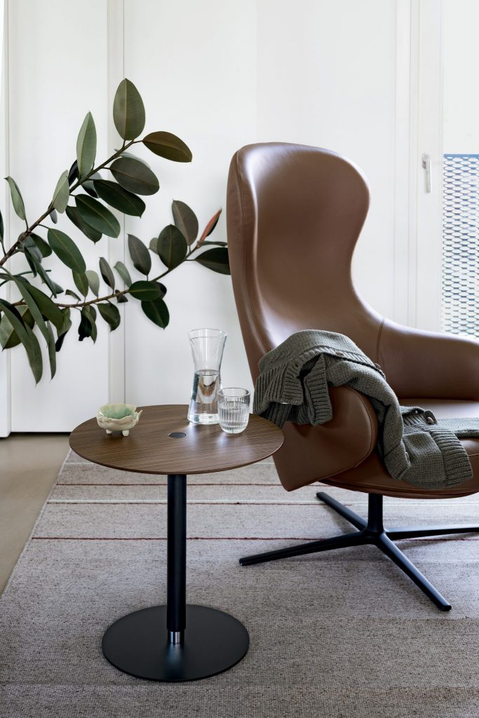 small adjustable table with a button in a brown tone made of wood and aluminum