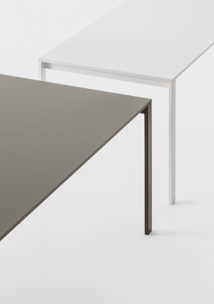 rwo table made in a rectangular shape with a lacquered wooden base in a gray and white tone