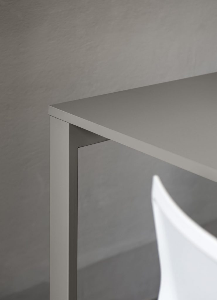 table made in a rectangular shape with a lacquered wooden base in a gray tone