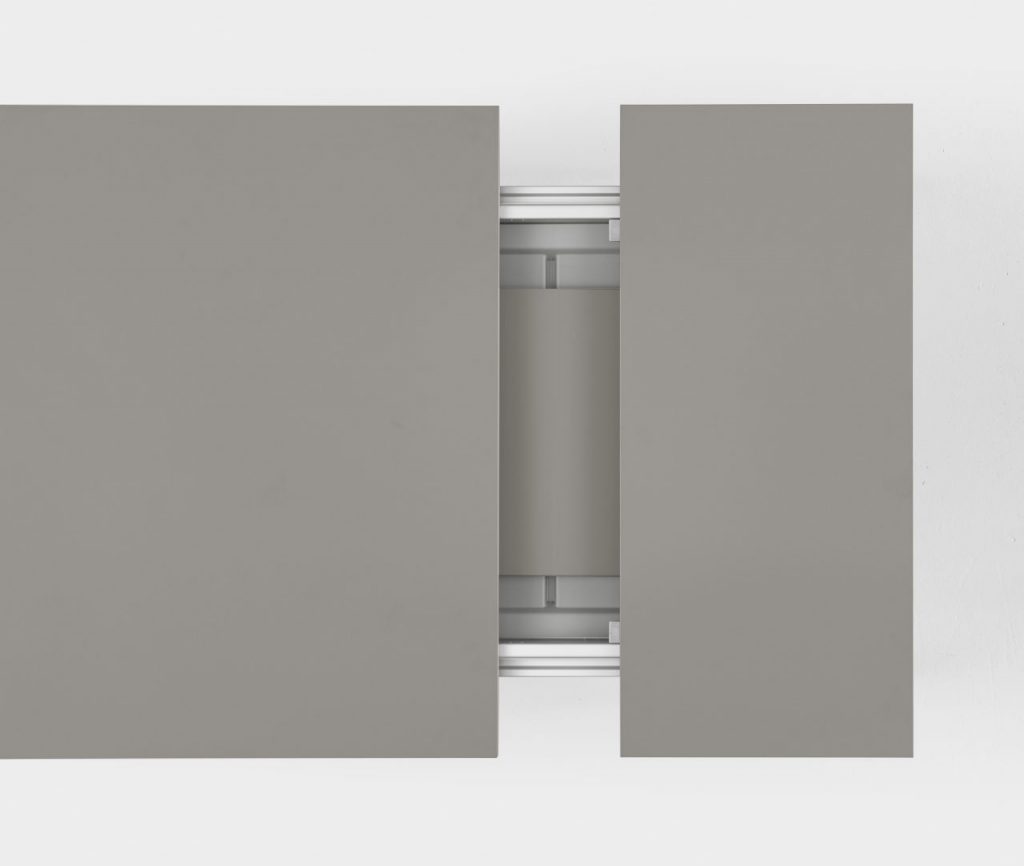 extendable table made of wood and aluminum in its structure in a light gray tone