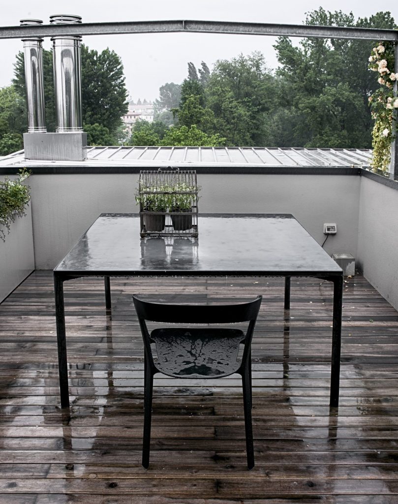 dining table made of gray cement and wooden legs