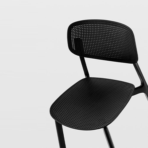 chair made of aluminum base and top made of perforated polypropylene in a black tone