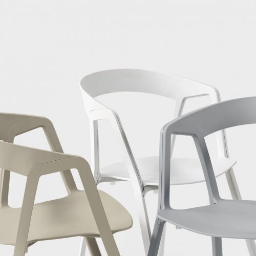 chairs made of plastic with a peculiar design with openings in its design in a tone of beige, white and blue