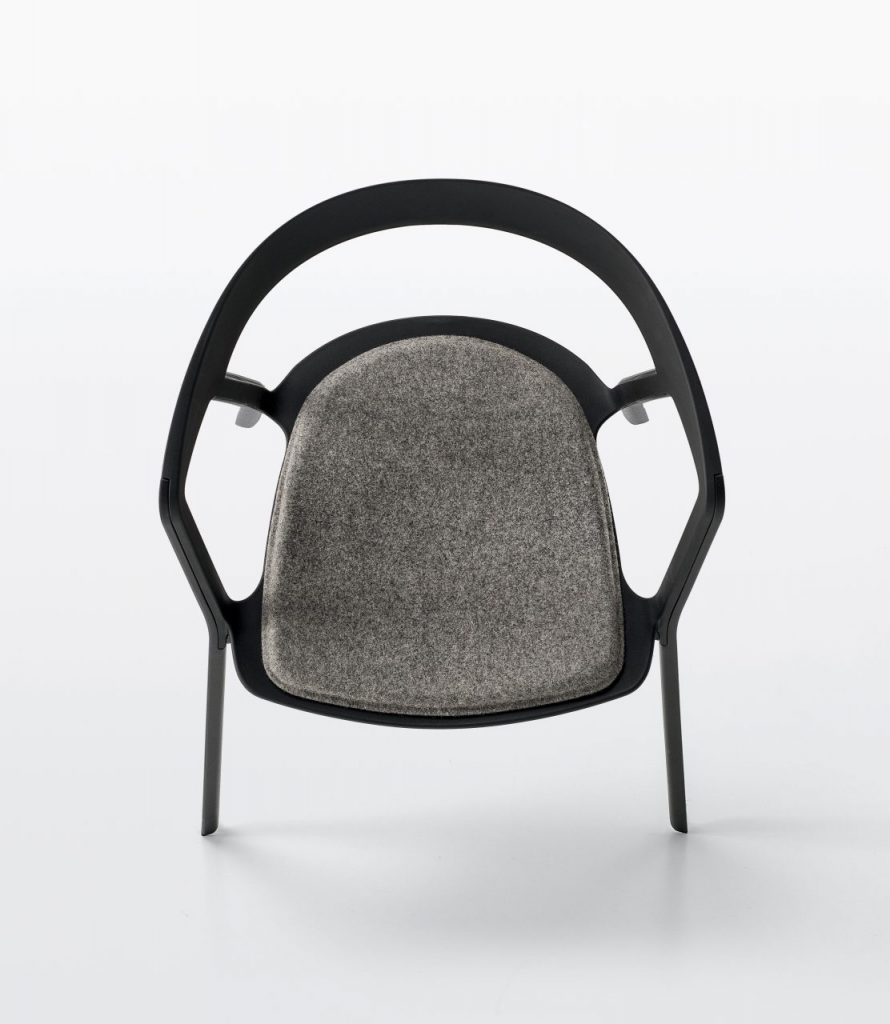 chair made of plastic with fabric cushion in a tone of black with gray