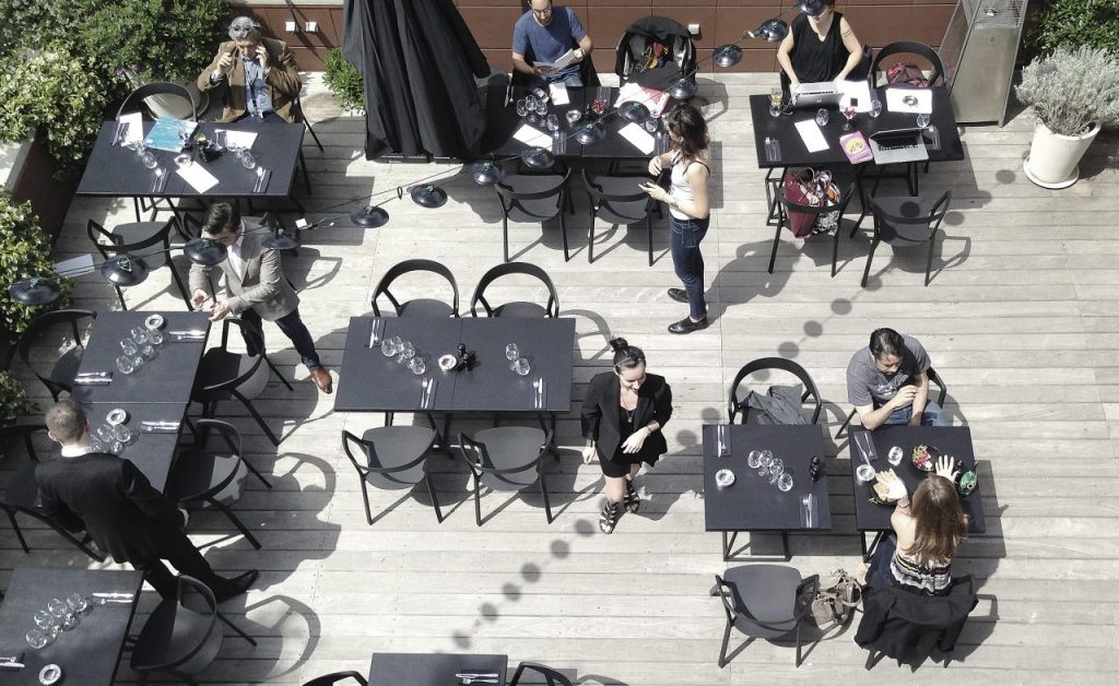 line of chairs with openings in their design made of plastic in a gray color tone