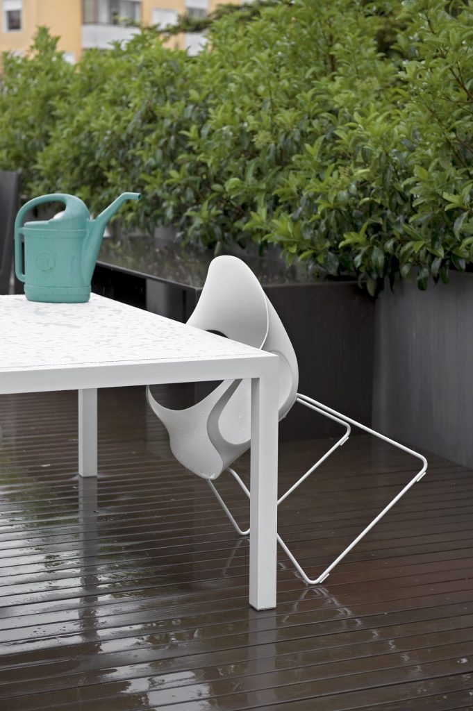 chair made of polyurethane and metal leg base in a white tone