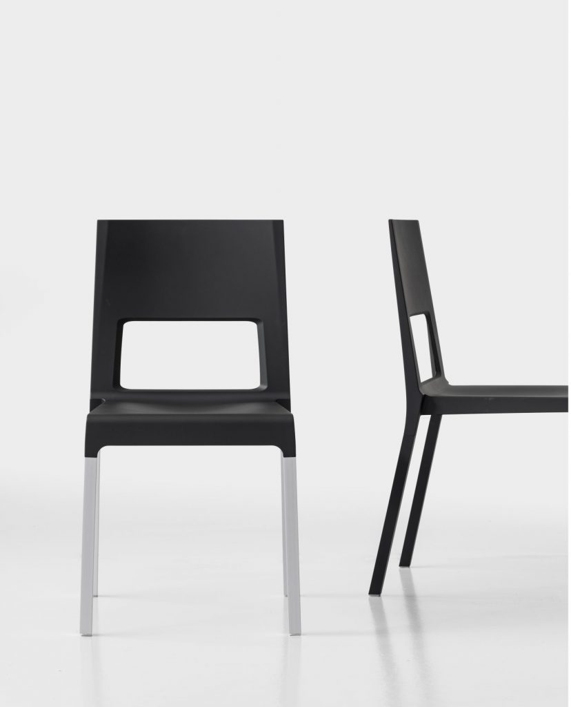 two chairs made of polyurethane base and aluminum base in a black tone on a white background
