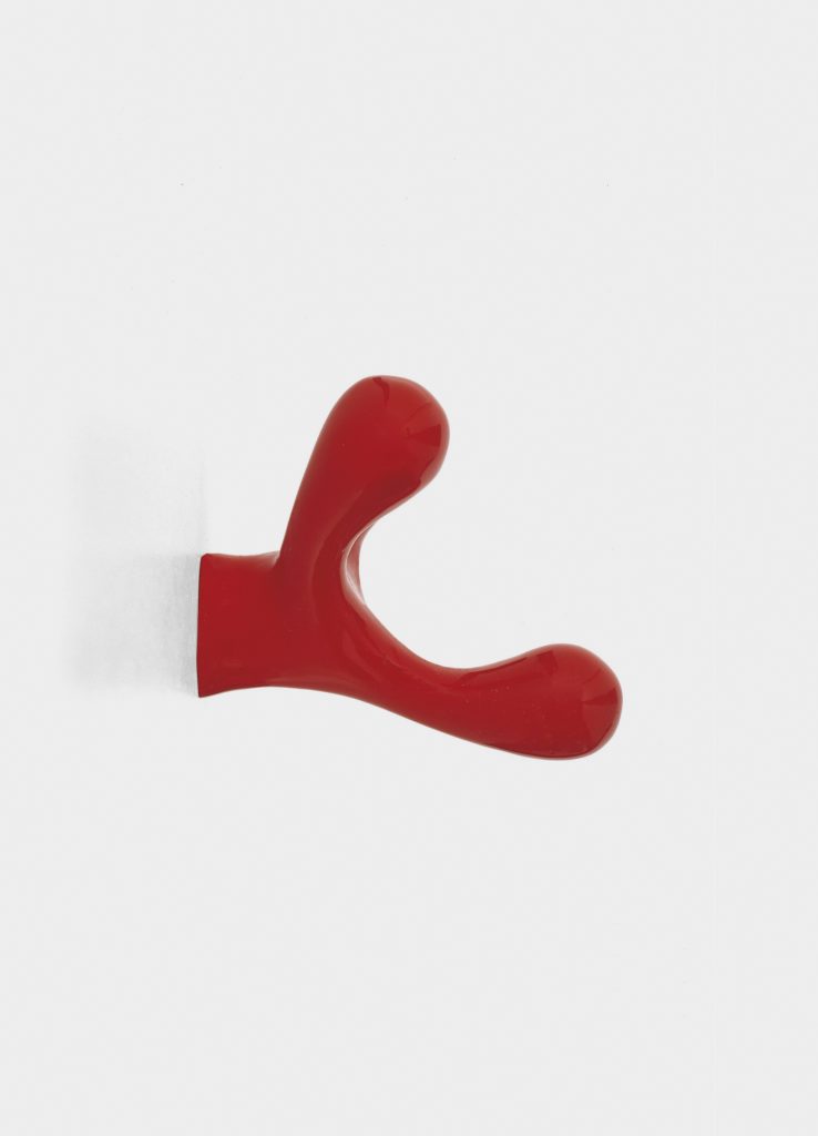 coat rack made of cast aluminum in the shape of reindeer horns in a red tone