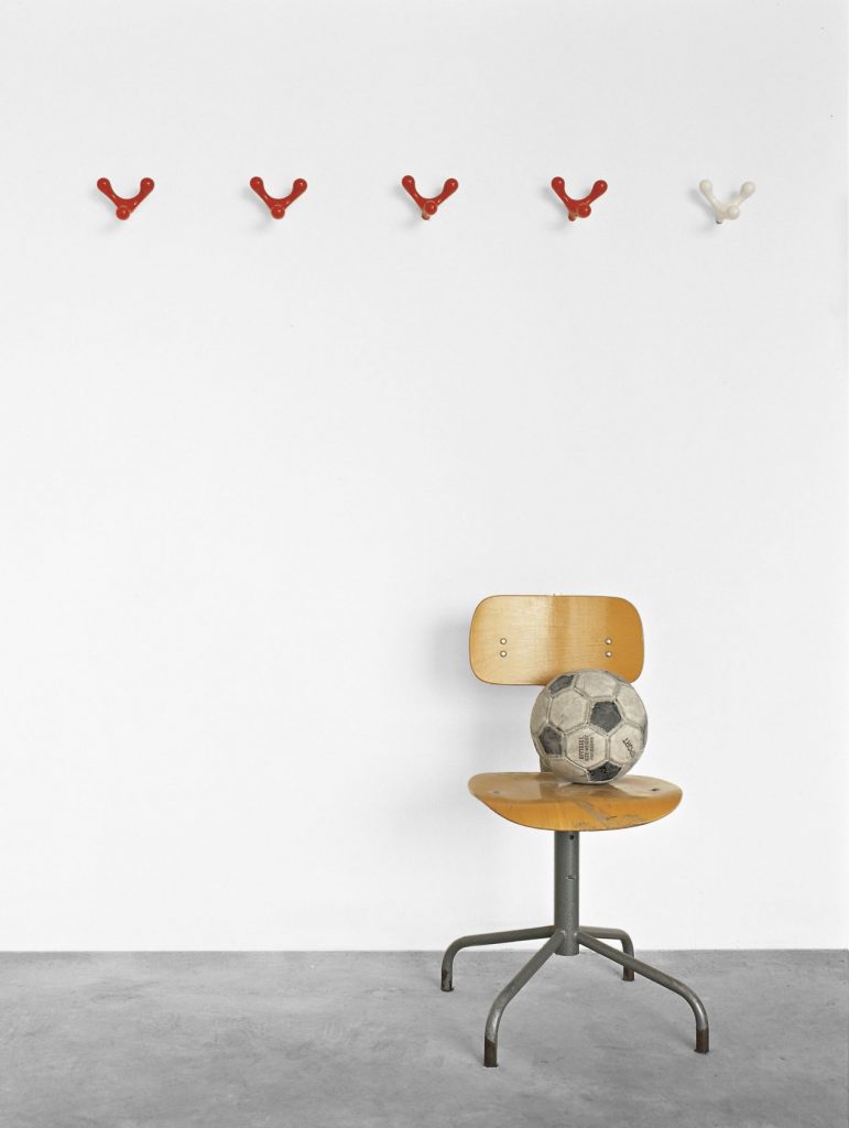 five coat racks made in the shape of reindeer antlers in a shade of red made from cast aluminum