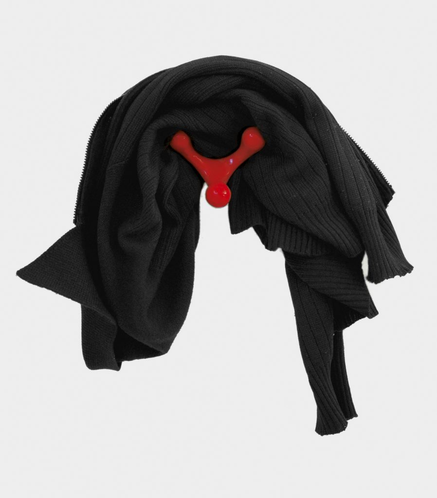 coat rack in a red tone made with a cast aluminum base in the shape of reindeer antlers