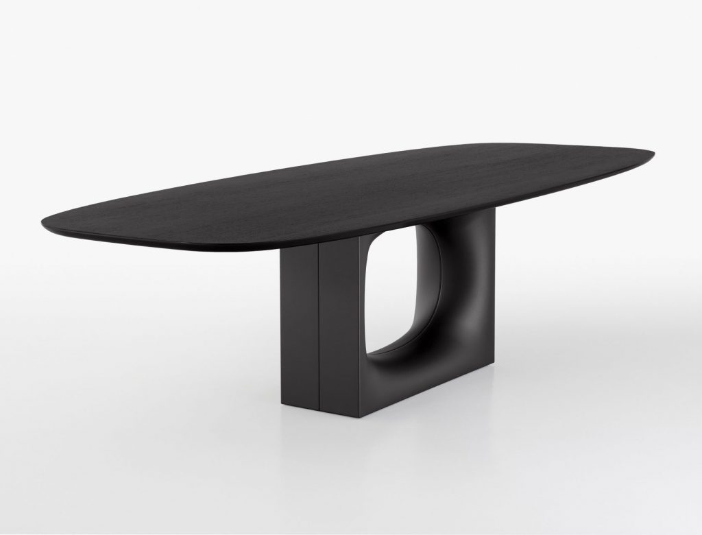 table center made with an oval hole in the center on a wooden and glass base in a black color tone