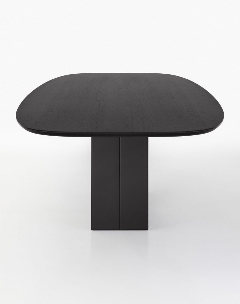table center made with an oval hole in the center on a wooden and glass base in a black color tone