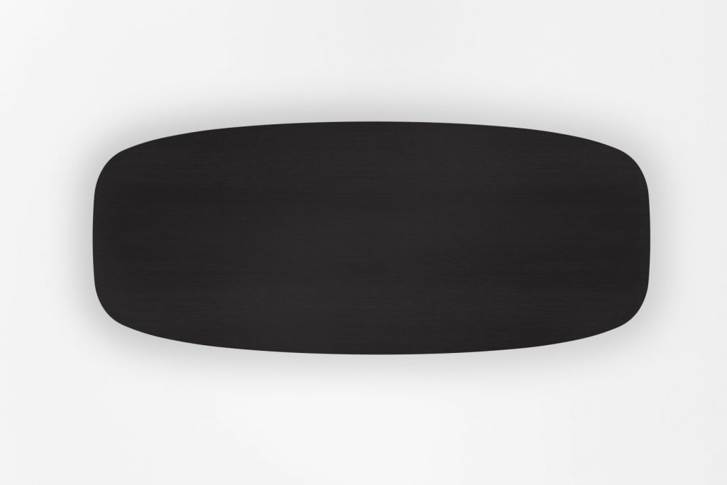 table center made with an oval hole in the center on a wooden and glass base in a black color tone