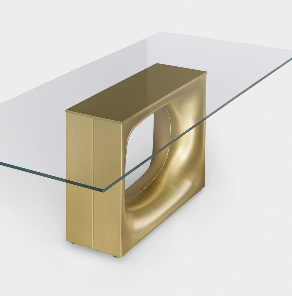 table made of wood and crystal base with hole in the center in a golden ciolor tone