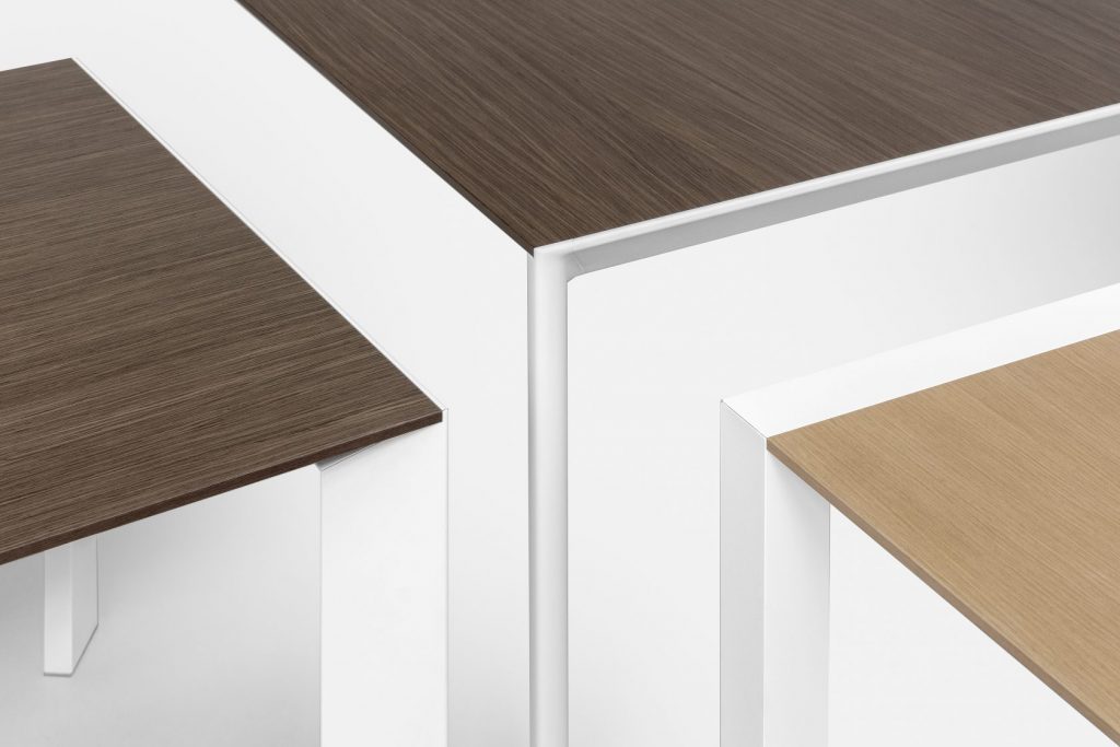 three tables made of wood and aluminum with rounded edges