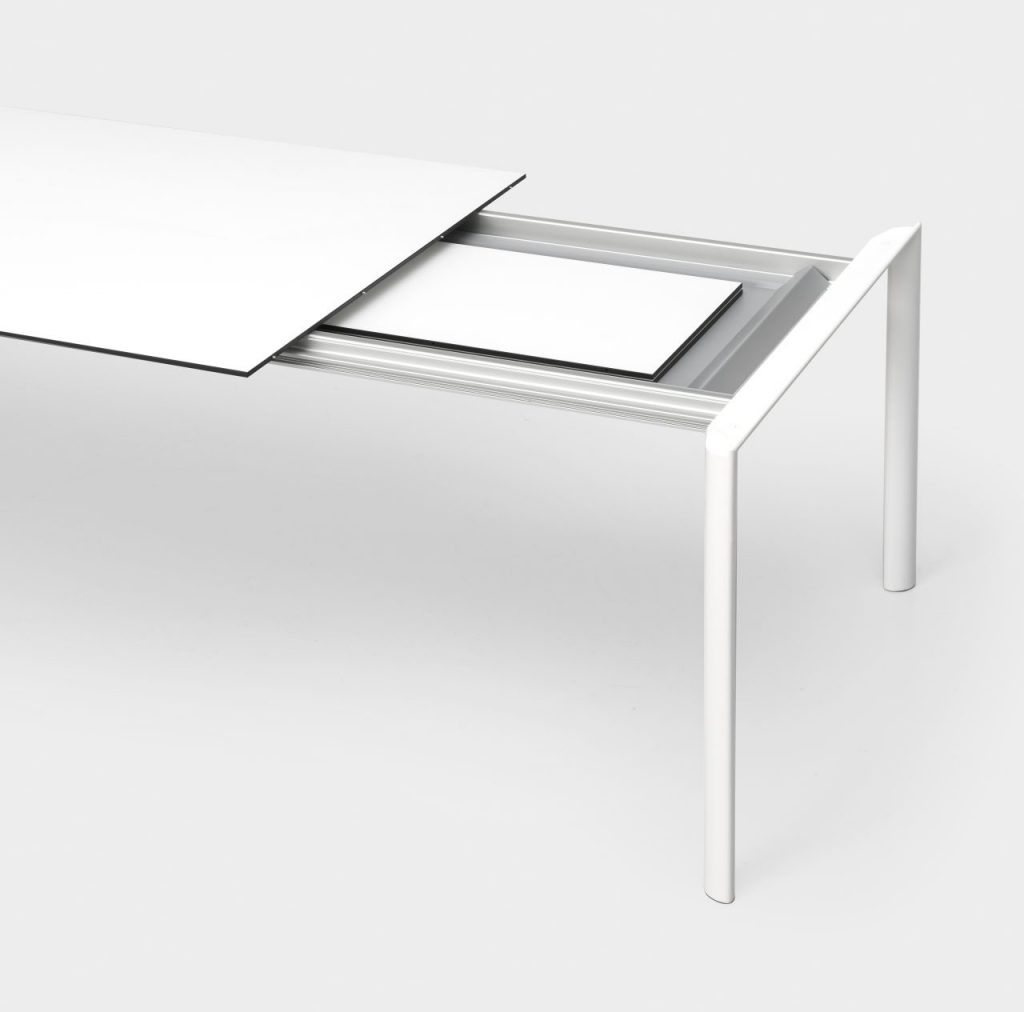 extendable table made of metal and aluminum in a white tone on a white background