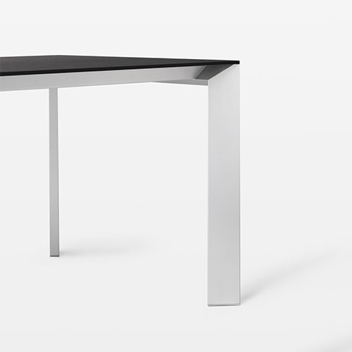 extendable table made of metal and aluminum in a black and gray tone on a white background