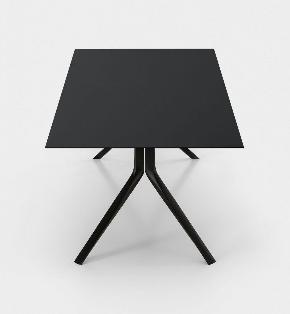 extendable table made of aluminum base and lacquered wood top in a black tone