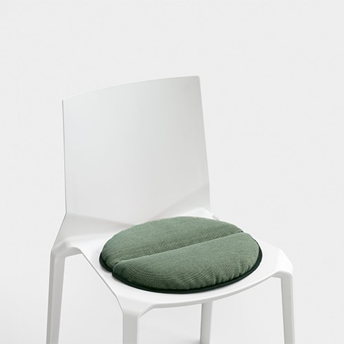 chair made of polypropylene base with cushion implemented in the seat in a tone of white with green