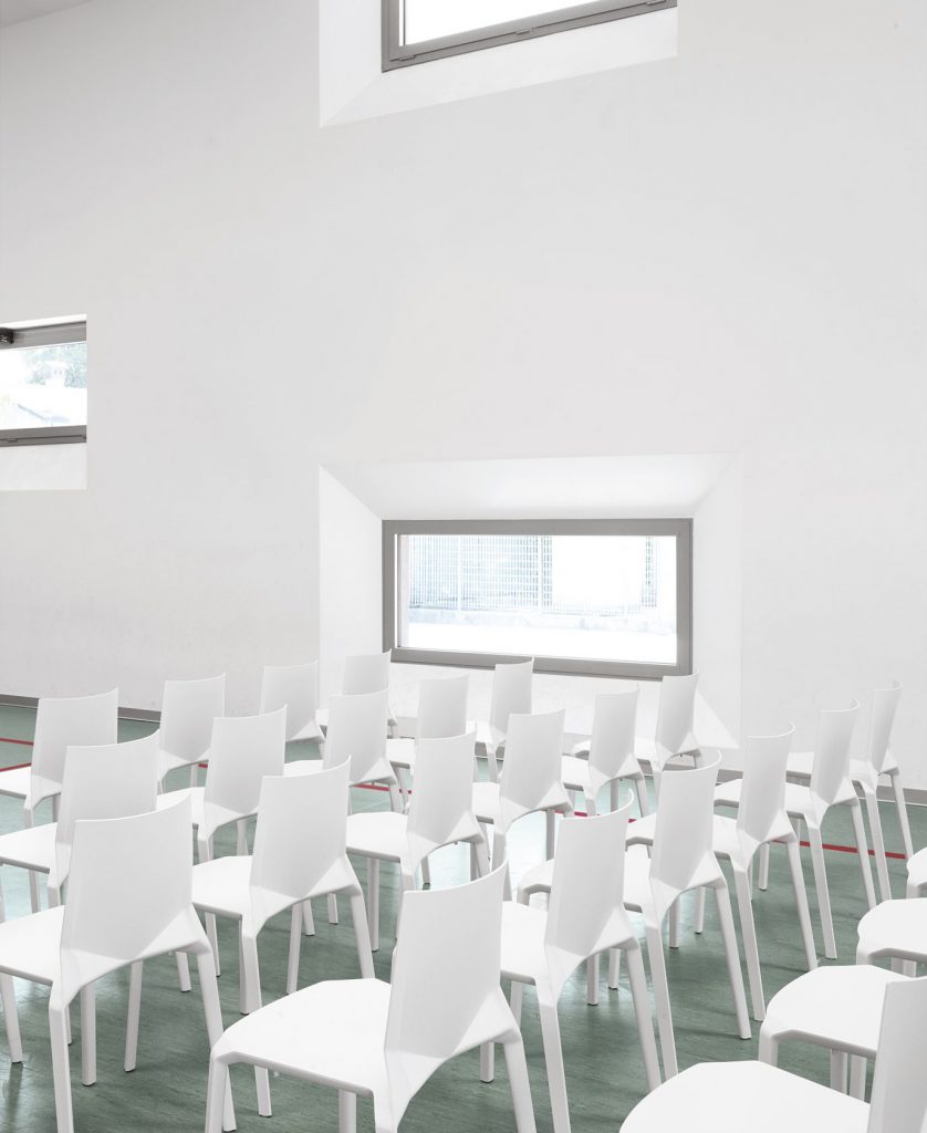 line of white chairs made from polypropylene in shades of white