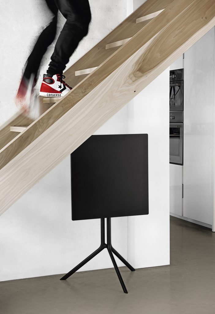 folding table made in the shape of a rectangle with an aluminum base in a black color tone