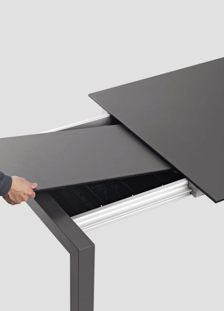 extendable table made of aluminum and wood in a blkack tone on a white background