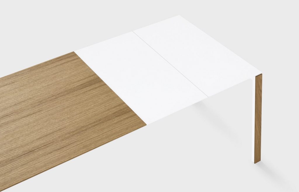 extendable table made of metal and aluminum in a white tone with coffee on a white background
