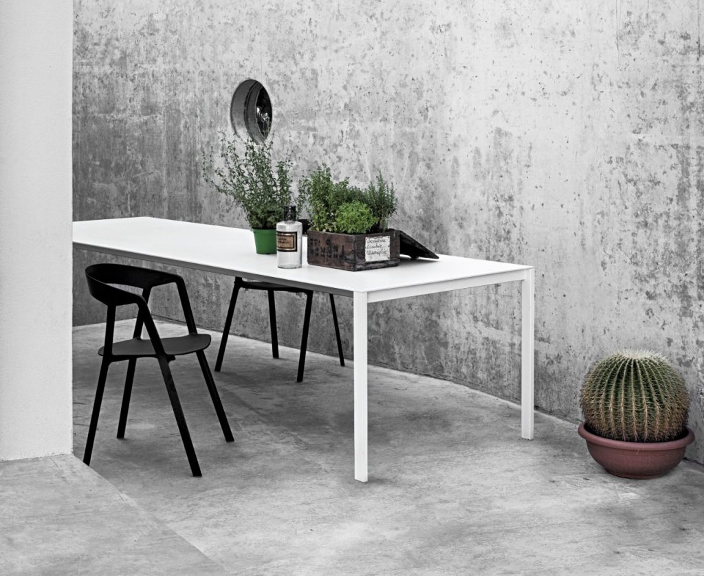 dining table made of metal or wood base and aluminum top in a white tone