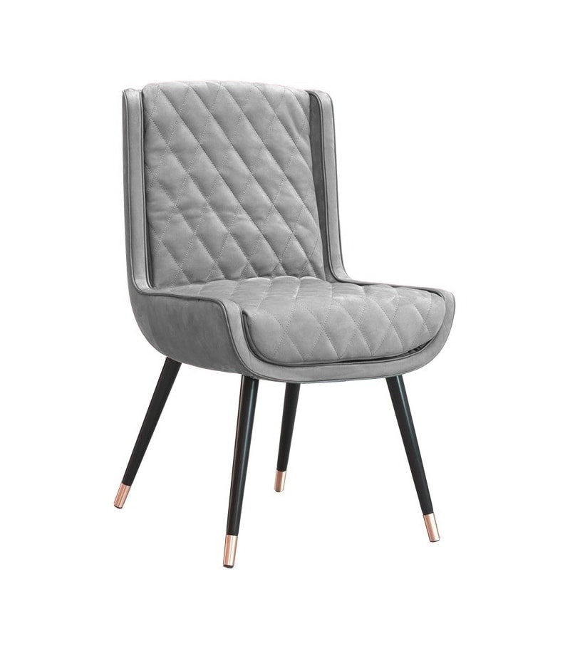 Chair made of gray leather with padded details on a black and brass varnished metal base on a white background.