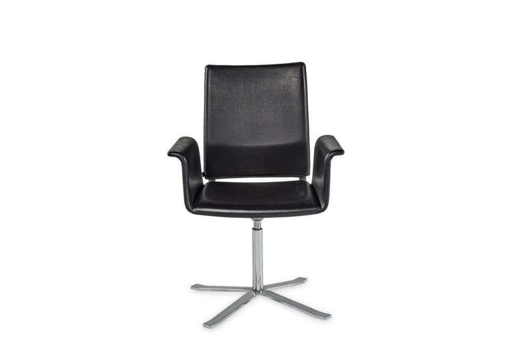 chair made of silver chrome adjustable swivel base and upholstered in glossy black leather