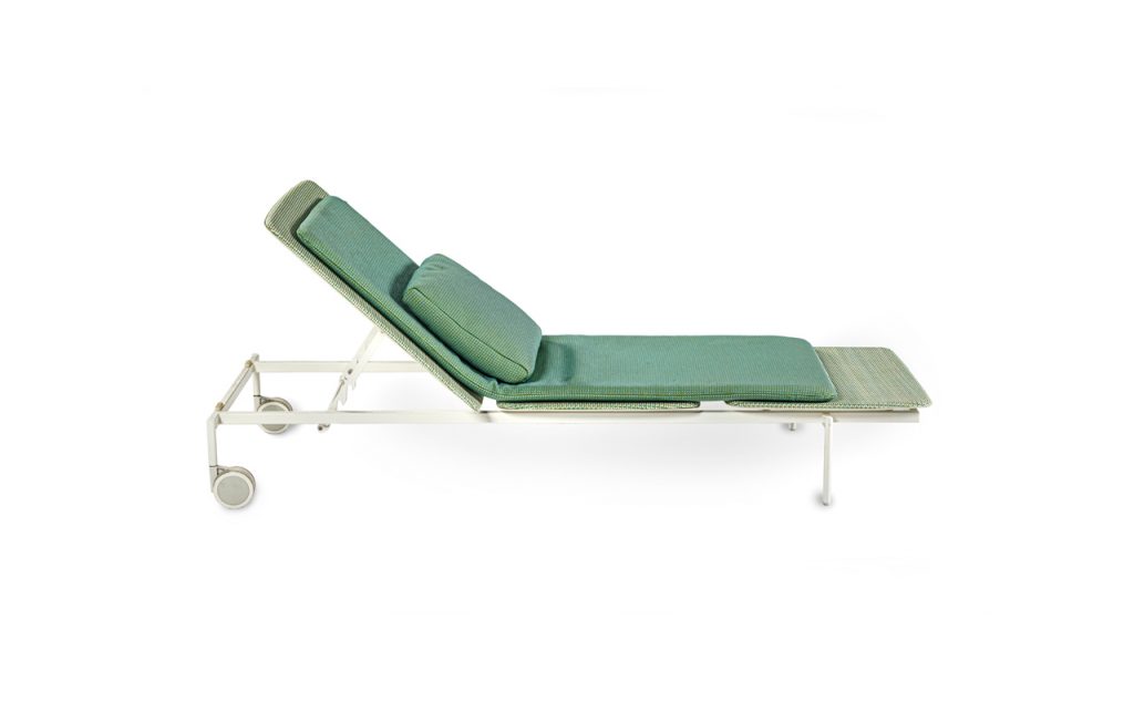 outdoor lounger made of metal upholstered in mesh fabric in an aquamarine green tone
