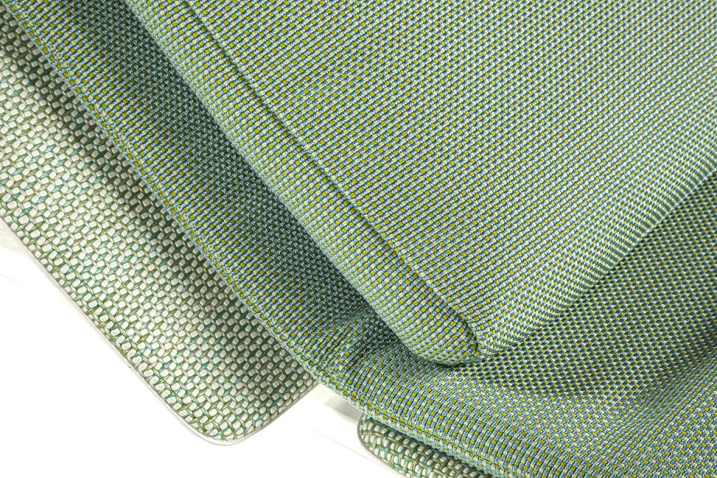 net-shaped fabric made in a light green color tone in patterns on a white background