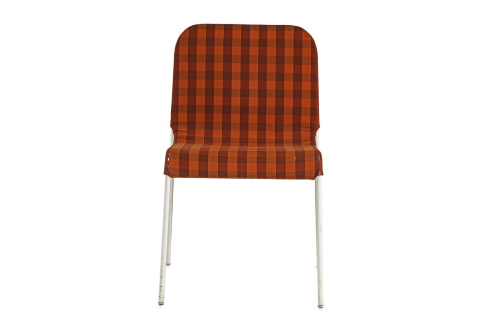 stackable dining chair made of stainless steel and upholstered in fabric cover in orange and red tones squares